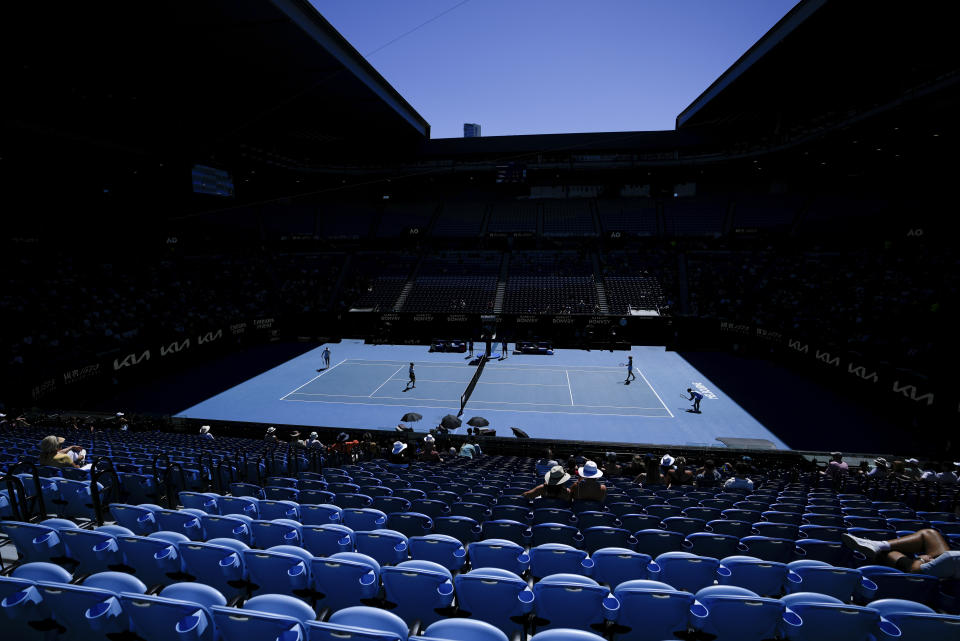 Spectators watch the the women's doubles final between Jelena Ostapenko of Latvia and Lyudmyla Kichenok of Ukraine against Hsieh Su-Wei of Taiwan and Elise Mertens of Belgium at the Australian Open tennis championships at Melbourne Park, in Melbourne, Australia, Sunday, Jan. 28, 2024. (AP Photo/Alessandra Tarantino)