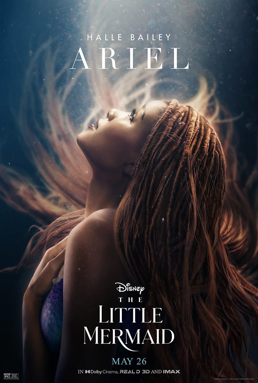 A close-up of Halle Bailey as Ariel looks up to the surface of the sea