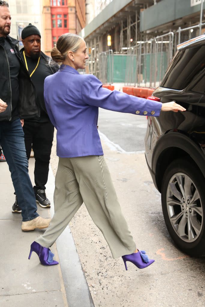 A closer look at Parker’s purple satin booties to match a purple jacket. - Credit: Splash