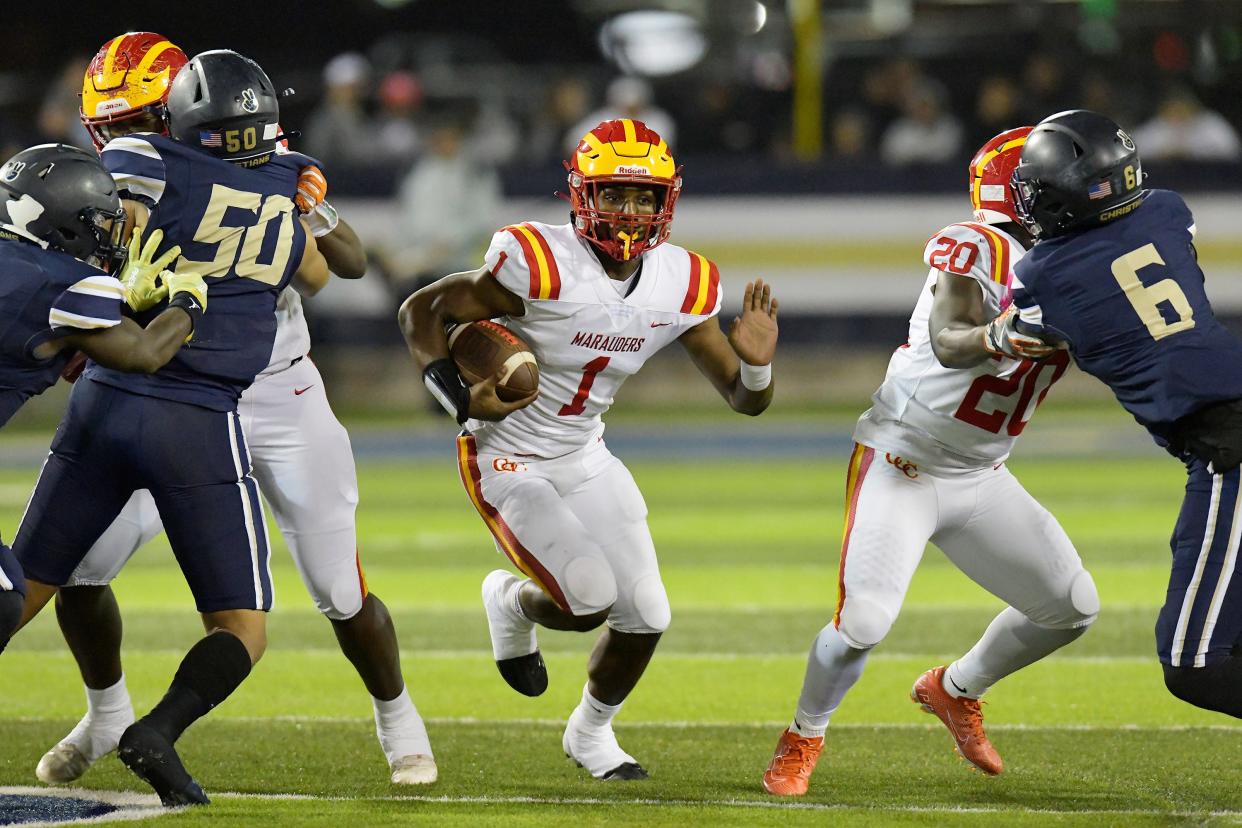 Clearwater Central Catholic's Quarterback Jershaun Newton (1) finds running room during early first quarter action. The Clearwater Central Catholic Marauders traveled to Jacksonville, FL to take on the University Christian Christians in the Florida High School Athletic Association Class 1M starts football semifinal match Friday, December 2, 2022. The Marauders came away with a 29 to 34 win over the Christians.