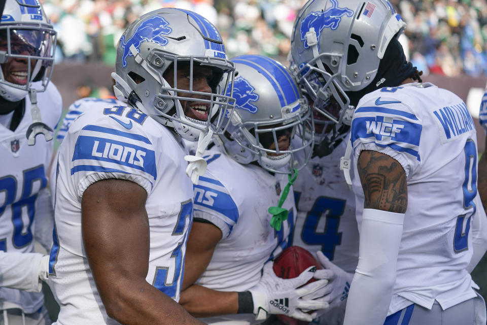 Detroit Lions wide receiver Kalif Raymond (11), celebrates with teammates after scoring a touchdown against the New York Jets during the first quarter of an NFL football game, Sunday, Dec. 18, 2022, in East Rutherford, N.J. (AP Photo/Seth Wenig)