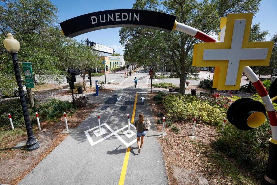 Walkers and cyclists make their way along the Pinellas Trail on Thursday, April 20, 2023, in Dunedin.