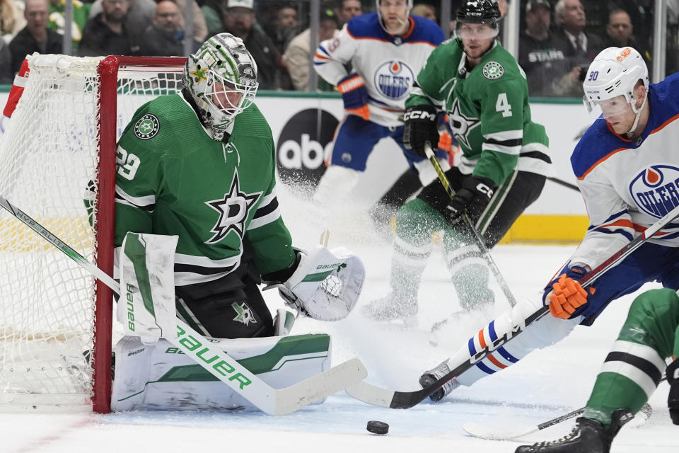 Edmonton Oilers right wing Corey Perry (90) moves in to score a goal against Dallas Stars goalie Jake Oettinger during the second period an NHL hockey game in Dallas, Saturday, Feb. 17, 2024. (AP Photo/LM Otero)