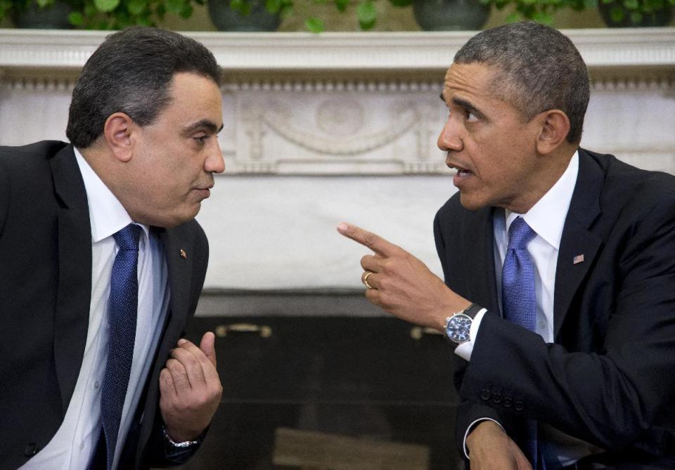 President Barack Obama meets with Tunisian Prime Minister Mehdi Jomaa, Friday, April 4, 2014, in the Oval Office of the White House in Washington. (AP Photo/Carolyn Kaster)