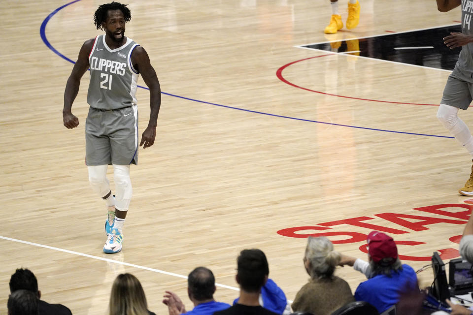 Los Angeles Clippers guard Patrick Beverley talks to fans during the second half in Game 4 of the NBA basketball Western Conference Finals against the Phoenix Suns Saturday, June 26, 2021, in Los Angeles. (AP Photo/Mark J. Terrill)