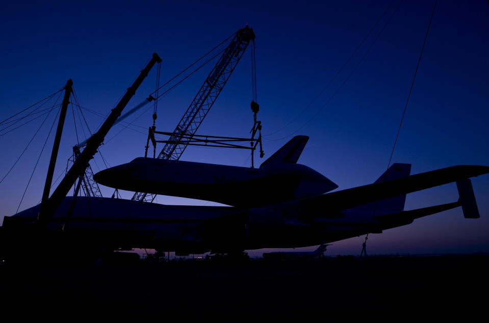 In this photo provided by NASA, the space shuttle Enterprise rests atop of the NASA 747 Shuttle Carrier Aircraft for transport to New York at Washington Dulles International Airport, Friday, April 20, 2012, in Sterling, Va. Enterprise is expected to go on display at the Intrepid Sea Air and Space Museum in New York. (AP Photo/NASA, Bill Ingalls)