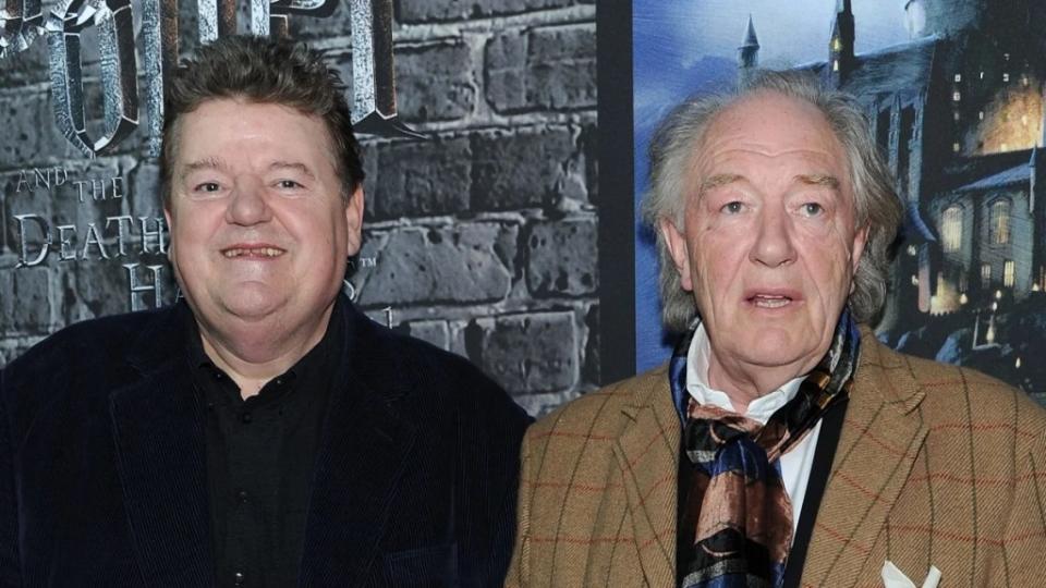Actors Robbie Coltrane and Sir Michael Gambon attend the grand opening of Harry Potter: The Exhibition at Discovery Times Square Exposition Center on April 4, 2011 in New York City. (Photo by Jason Kempin/Getty Images)