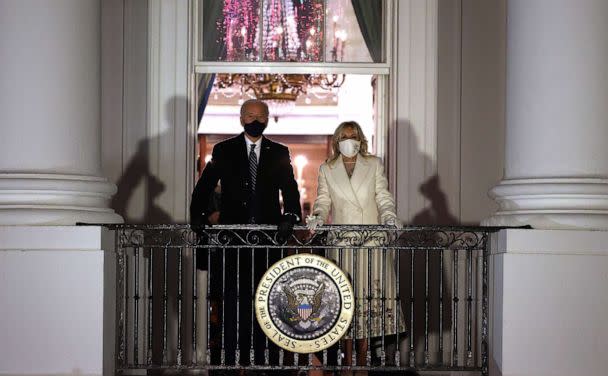 PHOTO: President Joe Biden and first lady Jill Biden watch a fireworks show celebrating his inauguration on the National Mall from the Truman Balcony at the White House Jan. 20, 2021, in Washington. (Chip Somodevilla/Getty Images)