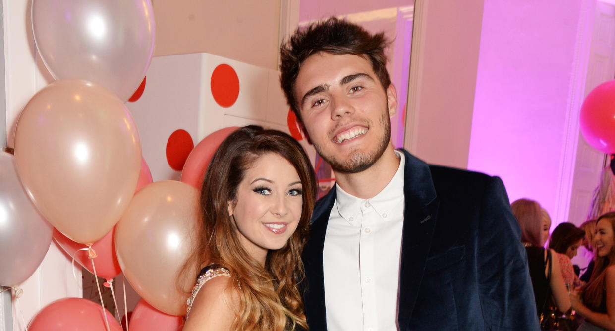 Zoe Sugg (L) and Alfie Deyes attend YouTube phenomenon Zoe Sugg's (Zoella) launch of her debut beauty collection in 2014. (Photo by David M. Benett/Getty Images for Zoella Beauty)