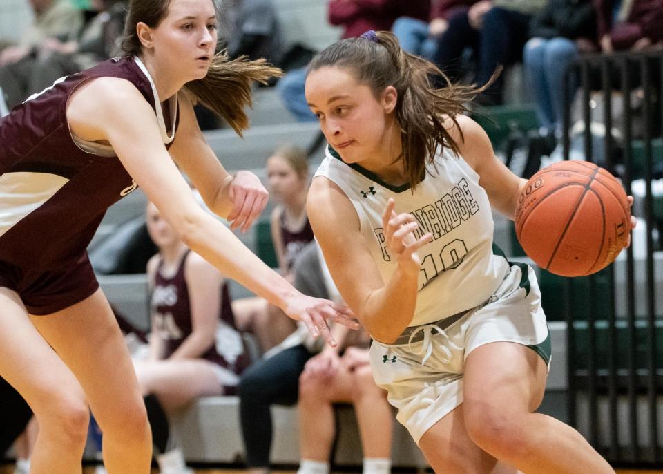 Pennridge's Ava Fantaskey drives past Garnet Valley's Katie Dwyer in a District One Class 6A first round playoff game at Pennridge High School in Perkasie on Friday, February 17, 2023. The Jaguars defeated the Rams 45-42.