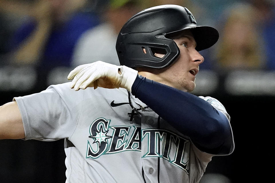 Seattle Mariners' Jarred Kelenic watches his two-run home run during the fourth inning of a baseball game against the Kansas City Royals Friday, Sept. 17, 2021, in Kansas City, Mo. (AP Photo/Charlie Riedel)