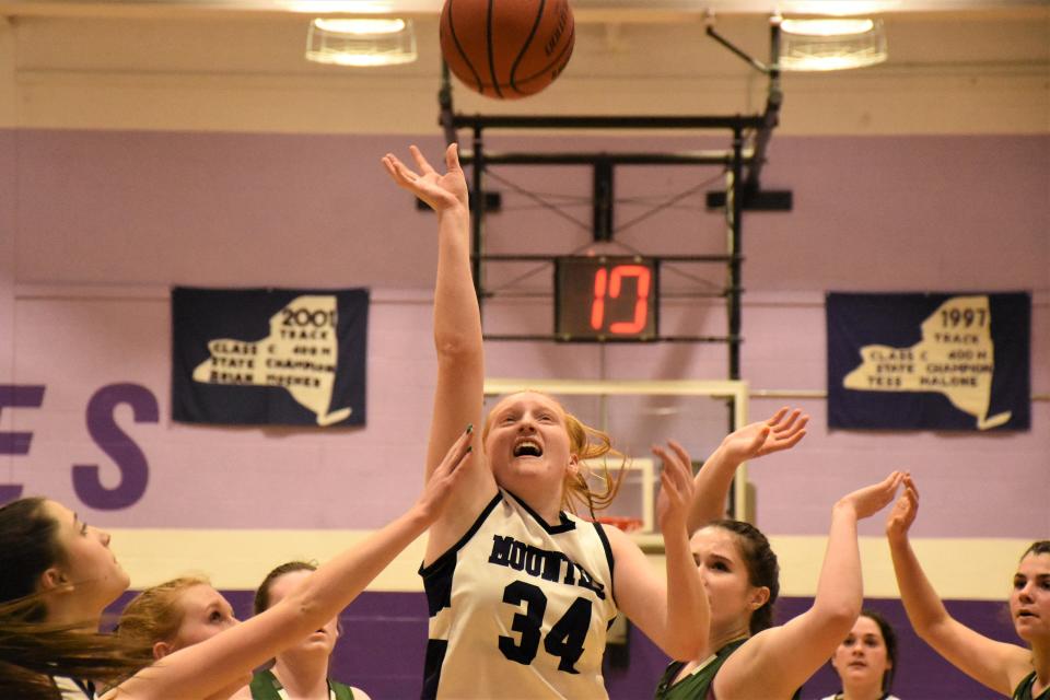 Little Falls Mountie Alexis Kress (34) shoots during the fourth quarter of Wednesday's game against Hamilton. Kress scored a game-high 23 points in the Mounties' overtime victory. Both teams had been undefeated entering the game.