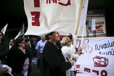 Protesters take part in an anti-austerity demonstration outside the Labour Ministry building in central Athens, Greece, October 15, 2015. REUTERS/Alkis Konstantinidis