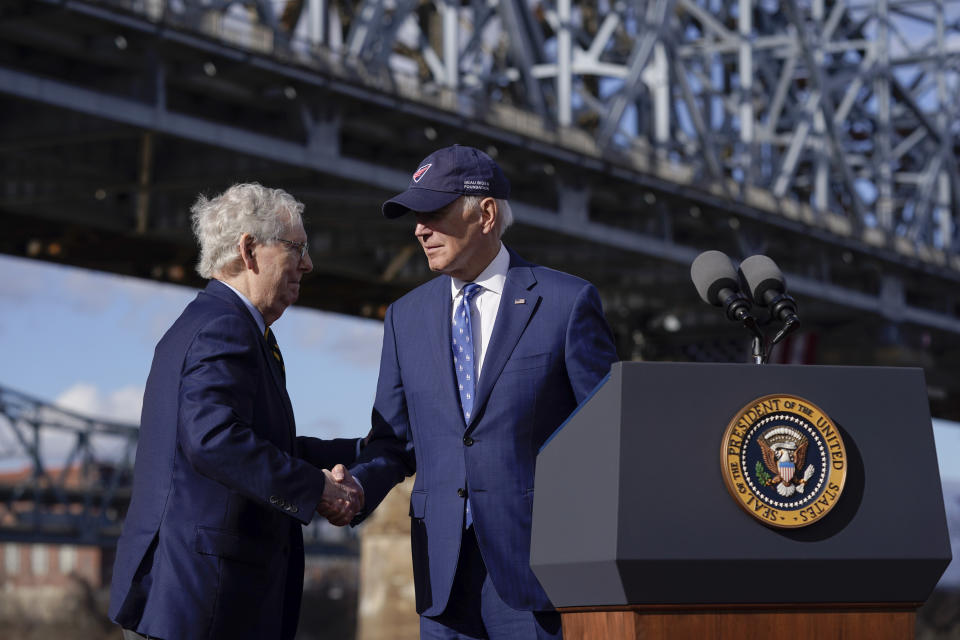 FILE - President Joe Biden shakes hands with Senate Minority Leader Mitch McConnell of Ky., after speaking about his infrastructure agenda under the Clay Wade Bailey Bridge, Jan. 4, 2023, in Covington, Ky. By temperament and manner, Joe Biden and Mitch McConnell are decidedly mismatched. But as the days of divided government under Biden begin, their long relationship will become even more vital. McConnell’s experience in cutting deals and the political capital he retains among his members could leave him much freer to negotiate thorny matters with the White House. (AP Photo/Patrick Semansky, File)