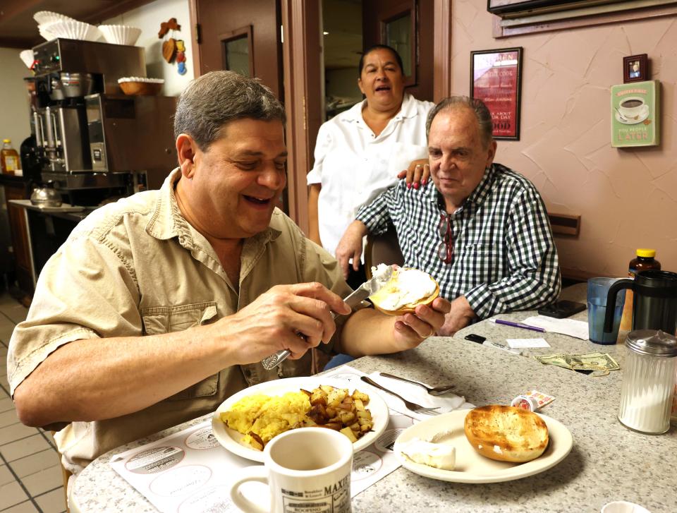 From left, customer Jim Sheroff, cook Joyce Ann Silva and owner Steve Robbins at Maxie's Deli, 117 Sharon St., Stoughton, on Friday, Aug. 12, 2022.