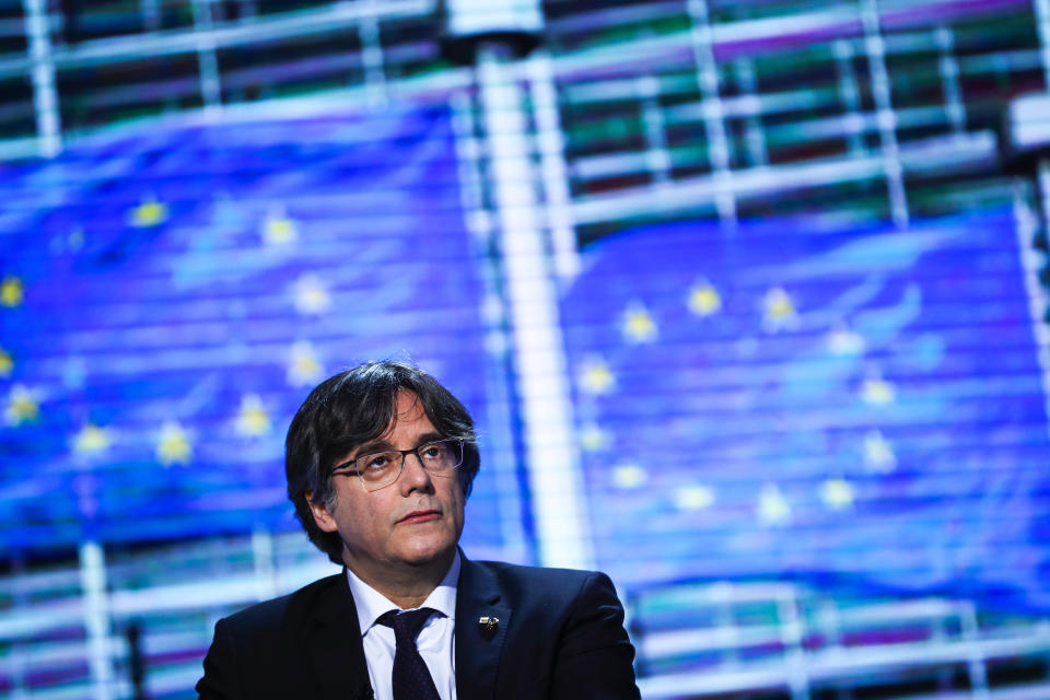 FILE - European Parliament's member Carles Puigdemont prepares for an interview at the European Parliament in Brussels on March 9, 2021. Nearly six years ago, the leader of Catalonia's failed secession bid slipped secretly across the Spanish border to escape arrest and start a life of a self-styled political exile. Now, Carles Puigdemont, after eluding repeated extradition attempts by Spanish justice, has the future of Spain’s government in his hands.(AP Photo/Francisco Seco, File)