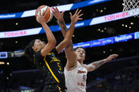 Los Angeles Sparks guard Dearica Hamby (5) shoots against Phoenix Mercury center Brittney Griner (42) during the first half of a WNBA basketball game in Los Angeles, Friday, May 19, 2023. (AP Photo/Ashley Landis)
