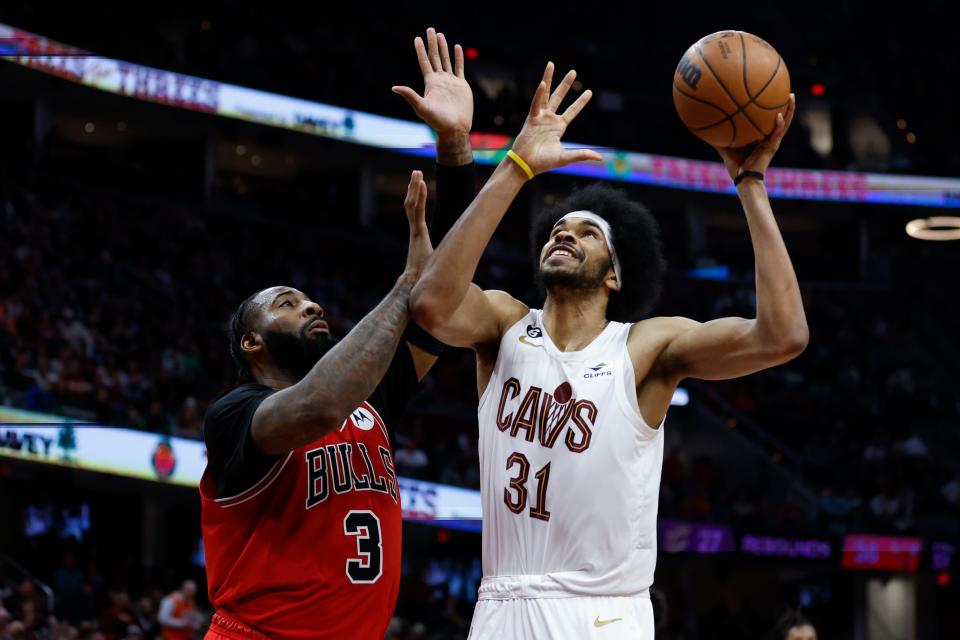 Cleveland Cavaliers center Jarrett Allen (31) shoots against Chicago Bulls center Andre Drummond (3) during the second half of an NBA basketball game, Saturday, Feb. 11, 2023, in Cleveland. (AP Photo/Ron Schwane)