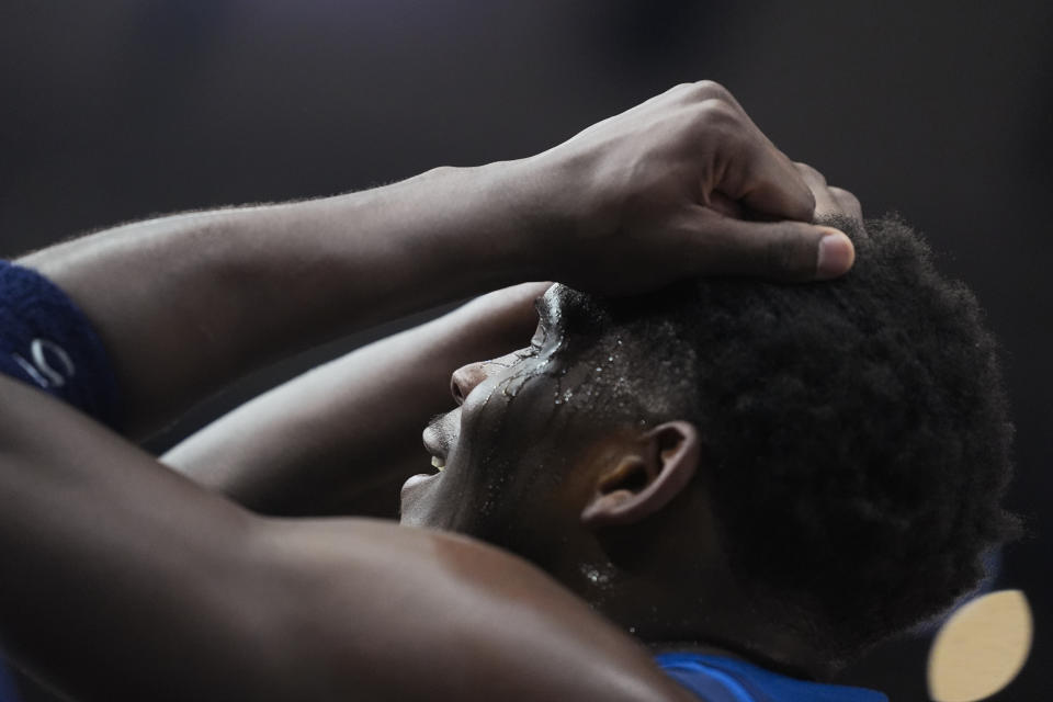 Minnesota Timberwolves guard Anthony Edwards grabs his head after being fouled during the first half of the team's NBA basketball game against the Chicago Bulls on Tuesday, Feb. 6, 2024, in Chicago. (AP Photo/Erin Hooley)