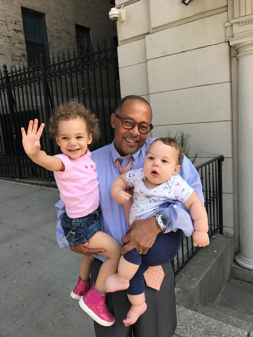 Dr. Jeff Gardere, of New York City, holds his children Nova, left, and Judah in August 2017 in Manhattan.