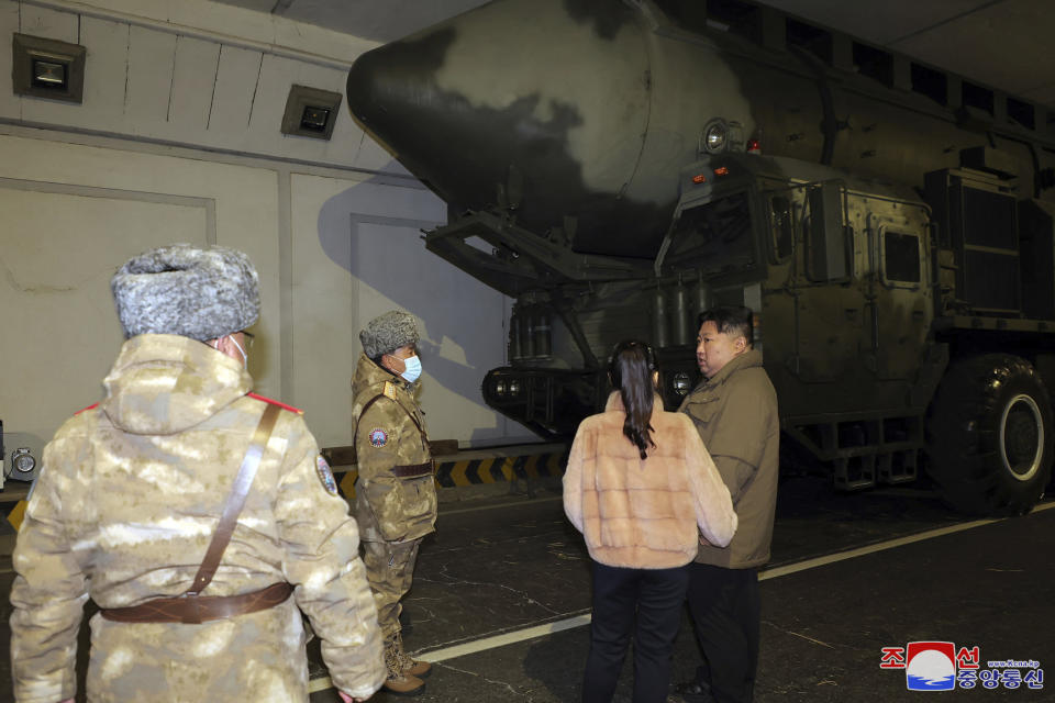 In this undated photo provided Tuesday, Dec. 19, 2023, by the North Korean government, North Korean leader Kim Jong Un, with his daughter and officials, inspects what it says is an intercontinental ballistic missile being prepared before launching from an undisclosed location in North Korea. Independent journalists were not given access to cover the event depicted in this image distributed by the North Korean government. The content of this image is as provided and cannot be independently verified. Korean language watermark on image as provided by source reads: "KCNA" which is the abbreviation for Korean Central News Agency. (Korean Central News Agency/Korea News Service via AP)