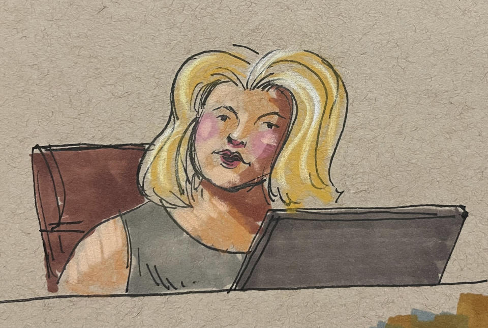 In this courtroom sketch, Shannon Basa-Sabol, the Allegheny County 911 dispatcher who fielded calls from the 2018 synagogue shootings, testifies in the federal trial for suspect Robert Bowers, on Tuesday, May 30, 2023, in Pittsburgh. Bowers could face the death penalty if convicted of some of the 63 counts he faces in the shootings, which claimed the lives of worshippers from three congregations who were sharing the building, Dor Hadash, New Light and Tree of Life. (David Klug via AP)