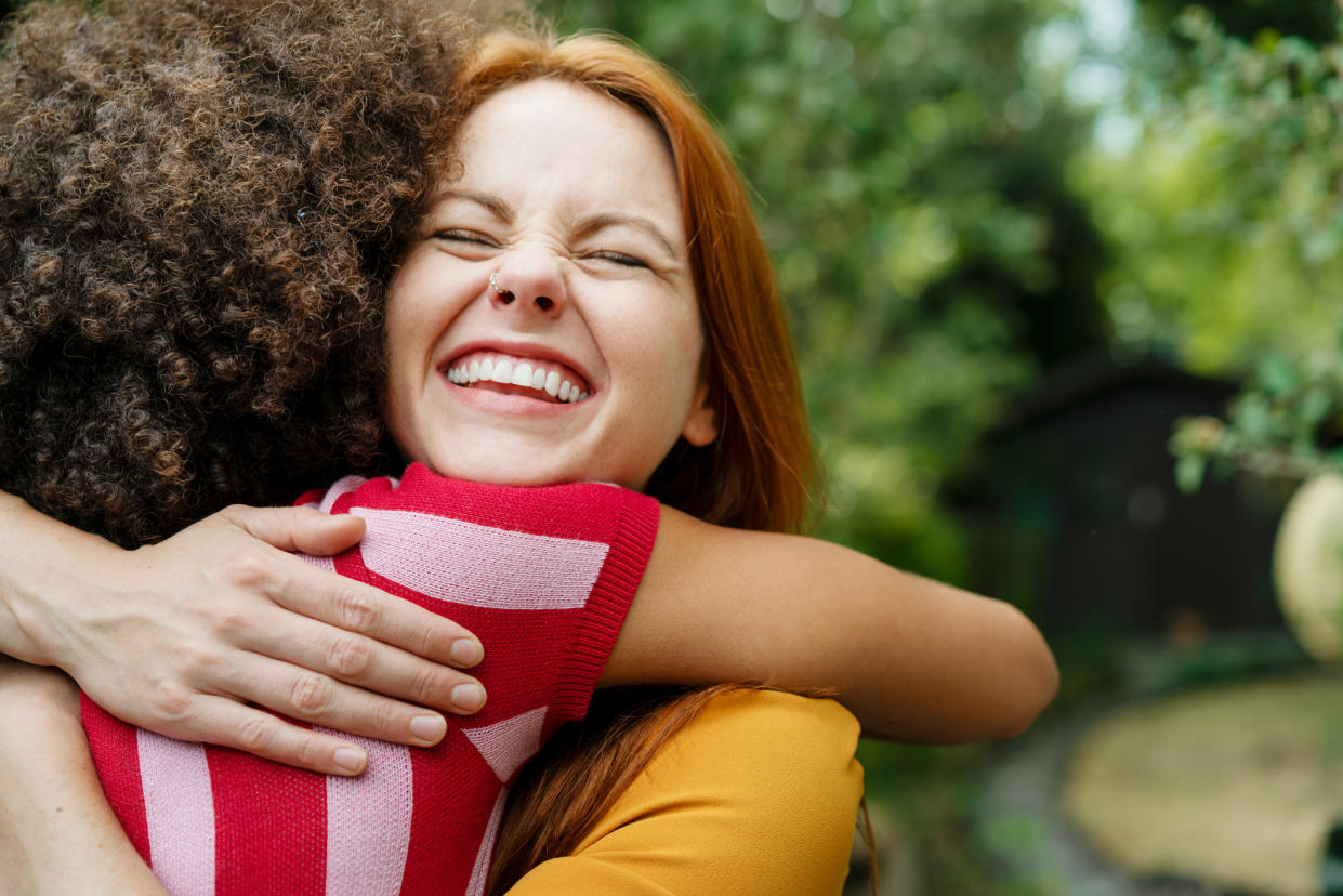 Turns out we've really missed being able to hug our friends. (Posed by models, Getty Images)