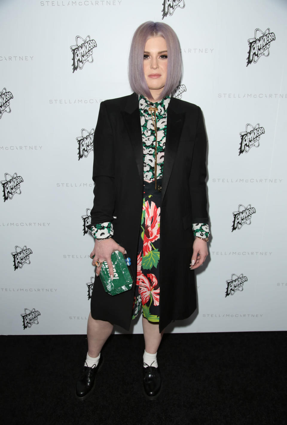 <p>Kelly Osbourne looked as fantastically quirky as ever in a floral ensemble teamed with a black coat.<i> [Photo: Rex]</i></p>