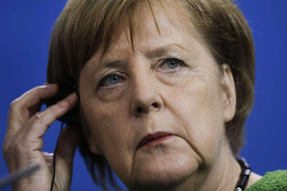 German Chancellor Angela Merkel attends a joint news conference with the President of Burkina Faso Roch Marc Christian Kabore after a meeting at the chancellery in Berlin, Germany, Thursday, Feb. 21, 2019. (AP Photo/Markus Schreiber)