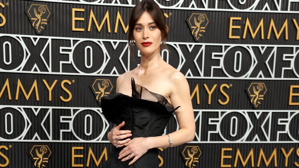 Lizzy Caplan wore an elegant black vintage Yohji Yamamoto dress. - Kevin Mazur/Getty Images