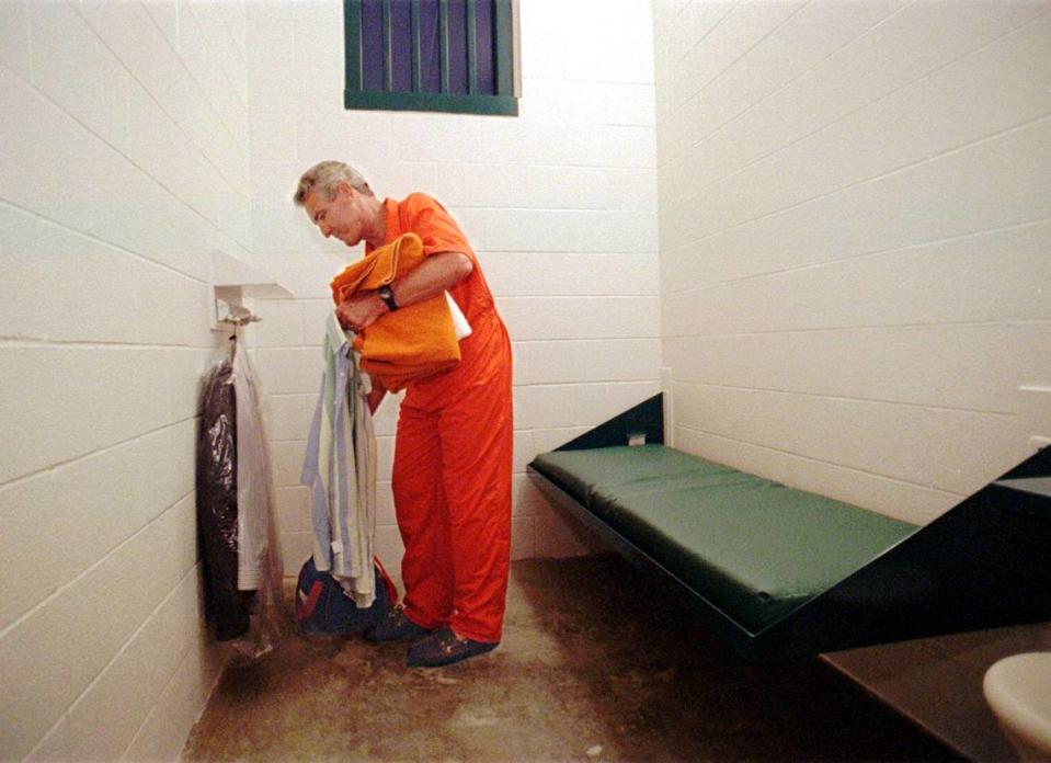 Wearing a jail jumpsuit, then-Mecklenburg County Manager Jerry Fox makes his bed in a cell at the new county jail on Spector Drive in north Charlotte. The sleep-over was supposed to help top county leaders learn a little about their newest $26 million investment and the life of an inmate.