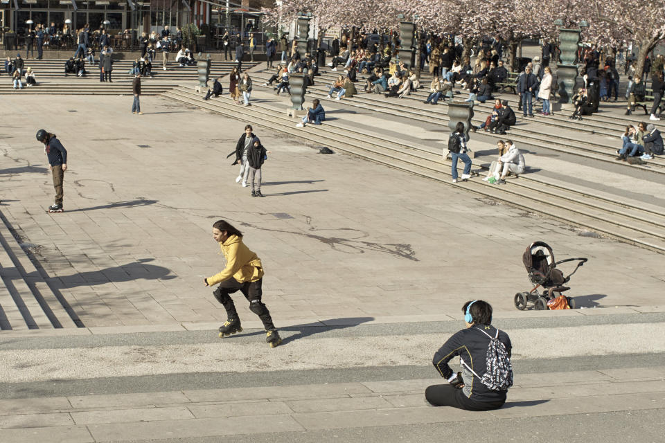 FILE - In this Saturday, April 4, 2020 file photo people visit a park in Stockholm, Sweden. (AP Photo/Andres Kudacki, File)