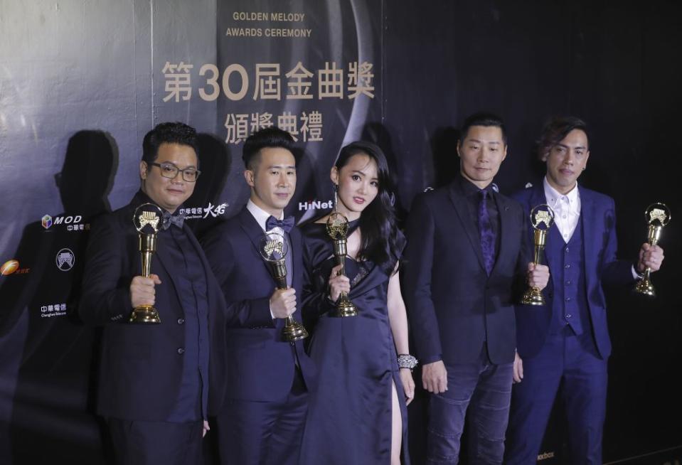 Taiwanese singers 'Chthonic' pose with their trophies after winning the Best Band at the 30th Golden Melody Awards in the Taipei on June 29, 2019. (Photo by Daniel Shih / AFP)        (Photo credit should read DANIEL SHIH/AFP/Getty Images)