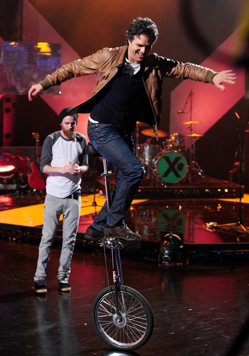 Mark Ruffalo on a very large unicycle