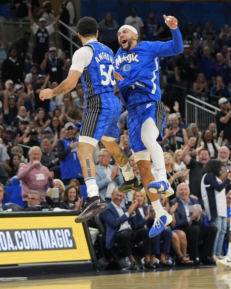 Orlando Magic guard Cole Anthony (50) celebrates his 3-point shot with guard Jalen Suggs, right, during the second half of an NBA basketball game against the Milwaukee Bucks, Sunday, April 14, 2024, in Orlando, Fla. (AP Photo/John Raoux)