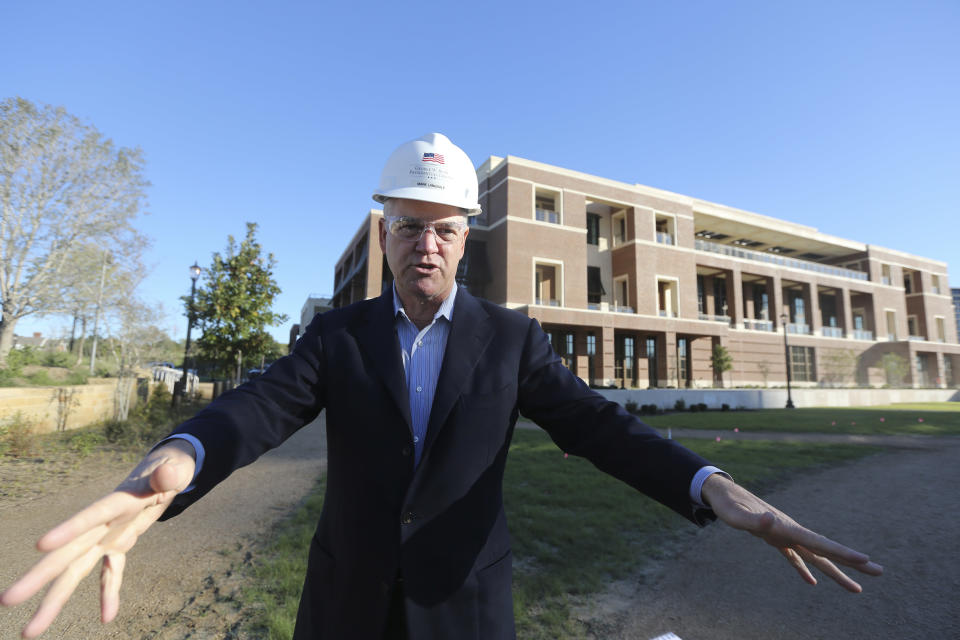 In this Monday, Oct. 29, 2012 photo, Mark Langdale, president of the George W. Bush Foundation, talks about the landscaping during a tour of the George W. Bush Presidential Center in Dallas. A 15-acre park at the upcoming George W. Bush Presidential Center will recreate a Texas prairie, complete with a wildflower meadow, a special blend of native grasses and even trees transplanted from the former president's ranch. The park's landscaping, which was completed this month, is a recreation of the kind of prairie landscape that would have existed in the area before it the city was built. (AP Photo/LM Otero)