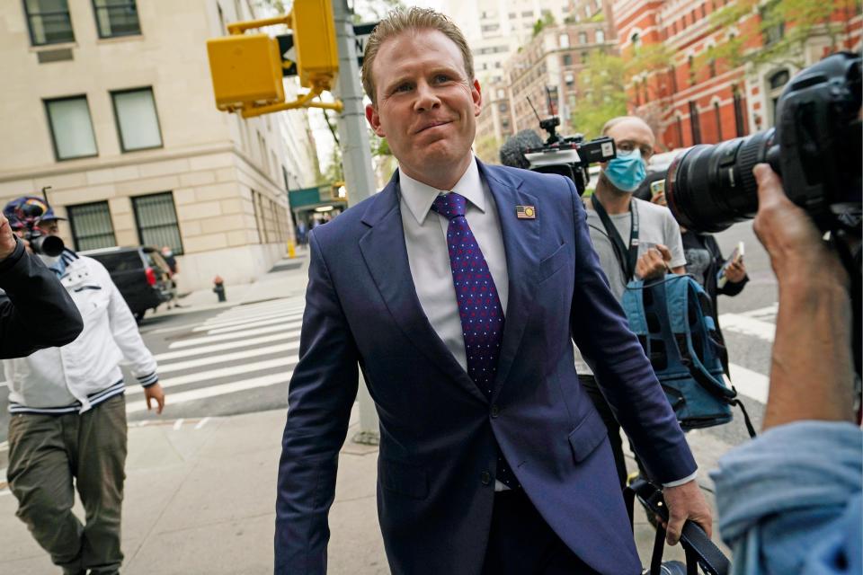 Andrew Giuliani, son of former New York City Mayor Rudy Giuliani, walks down the block after leaving his father's apartment, Wednesday, April 28, 2021, in New York. Federal agents raided Rudy Giuliani's Manhattan home and office Wednesday, seizing computers and cellphones in a major escalation of the Justice Department's investigation into the business dealings of former President Donald Trump's personal lawyer. Andrew Giuliani told reporters the raids were "disgusting" and "absolutely absurd." (AP Photo/Kathy Willens)