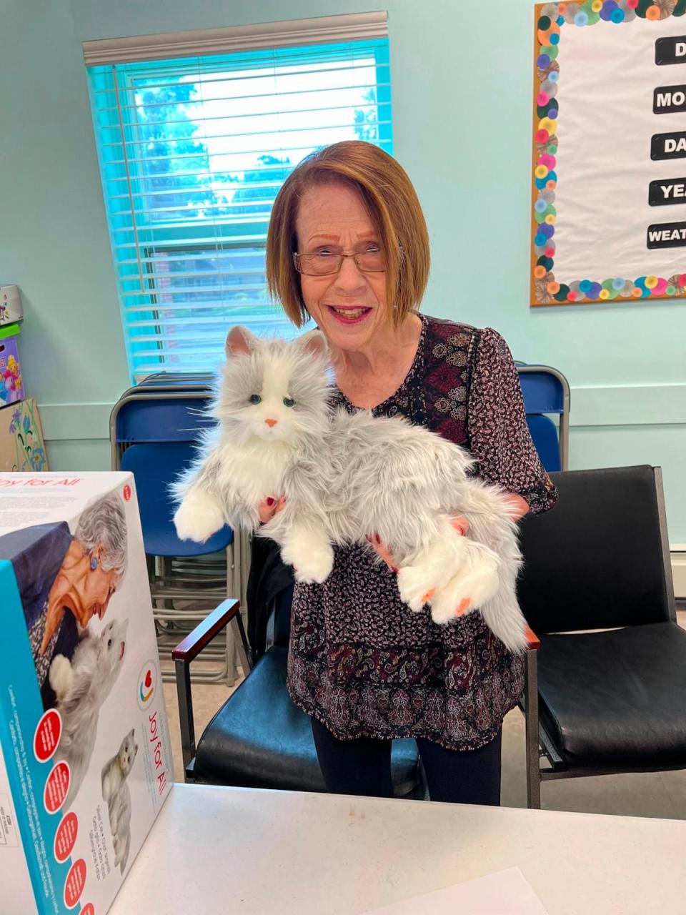 PHOTO: More than 4,000 robotic pets will be be distributed among seniors by the New York State Office For Aging. Pictured: Judy Shapiro with her robotic cat. (New York State Office For Aging)