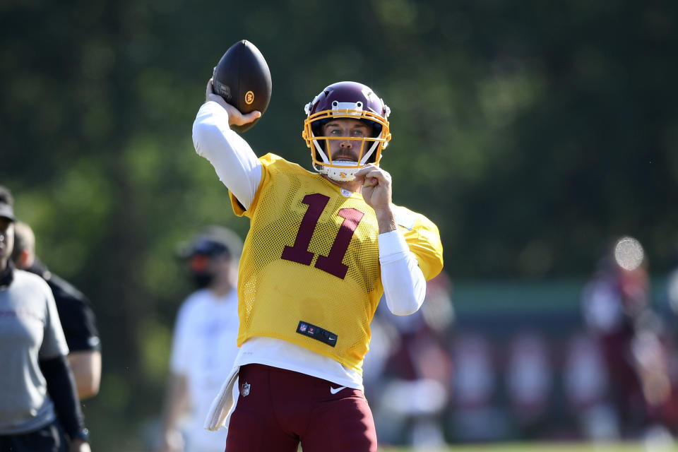 Washington quarterback Alex Smith passes the ball during practice at the team's NFL football training facility.