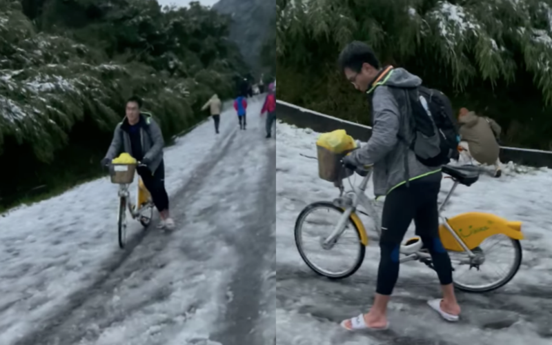 一名男子昨天騎著YouBike只穿著拖鞋，就衝陽明山二子坪賞雪，結果地面結冰寸步難行。（翻攝臉書社團「●【爆廢公社公開版】●」，影片由網友 Nick Yang 拍攝）