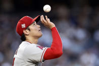 Los Angeles Angels pitcher Shohei Ohtani tosses the ball during the first inning of the team's baseball game against the New York Yankees on Wednesday, June 30, 2021, in New York. (AP Photo/Adam Hunger)