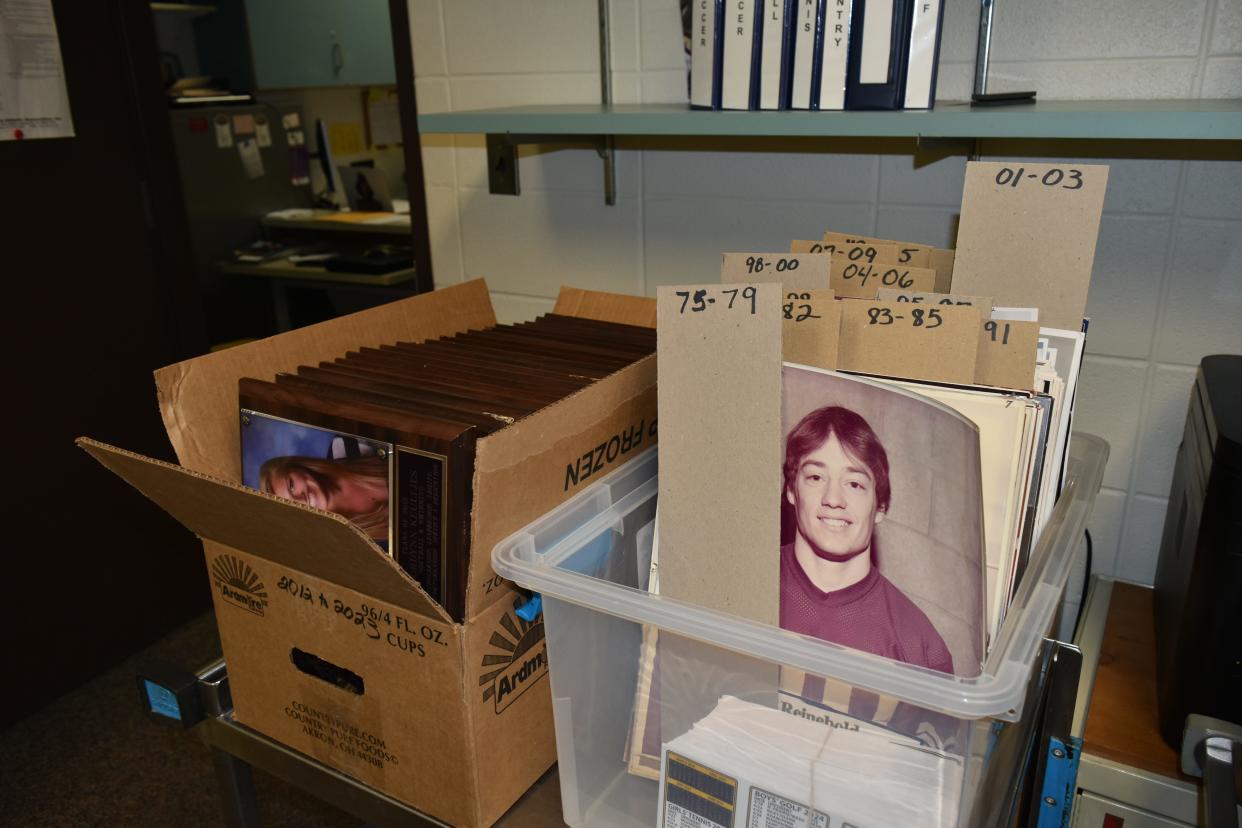 Photos and plaques of former Clay High School students and athletes have been organized for alumni to pick them up now through the first week of June.