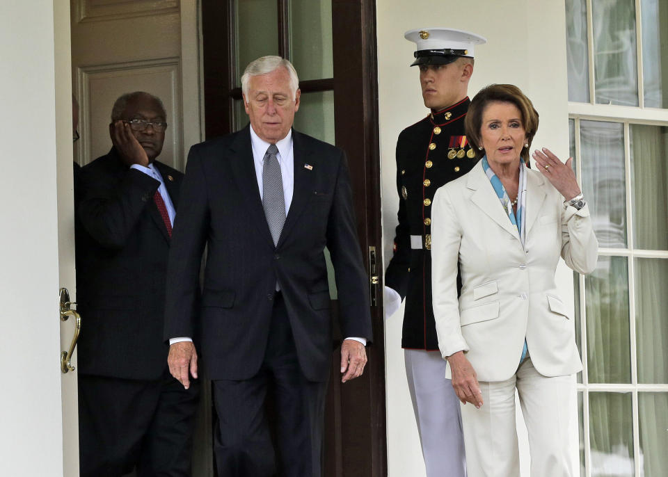 From left, Rep. James Clyburn, D-S.C., Rep. Steny Hoyer, D-Md., and House Minority Leader Nancy Pelosi of Calif., walk out of the West Wing of the White House to speak with reporters following their meeting with President Barack Obama and Vice President Joe Biden, Tuesday, Oct. 15, 2013, in Washington. (AP Photo/Pablo Martinez Monsivais)