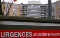 Signs in the windor of the hospital Victor Provo read "Covid crisis, all masked" in Roubaix, northern France, Wednesday, Oct. 28, 2020. France is bracing for a potential new lockdown as the president prepares a televised address Wednesday aimed at stopping a fast-rising tide of virus patients filling French hospitals and a growing daily death toll. French markets opened lower on expectations that President Emmanuel Macron will announce some kind of lockdown Wednesday. (AP Photo/Michel Spingler)