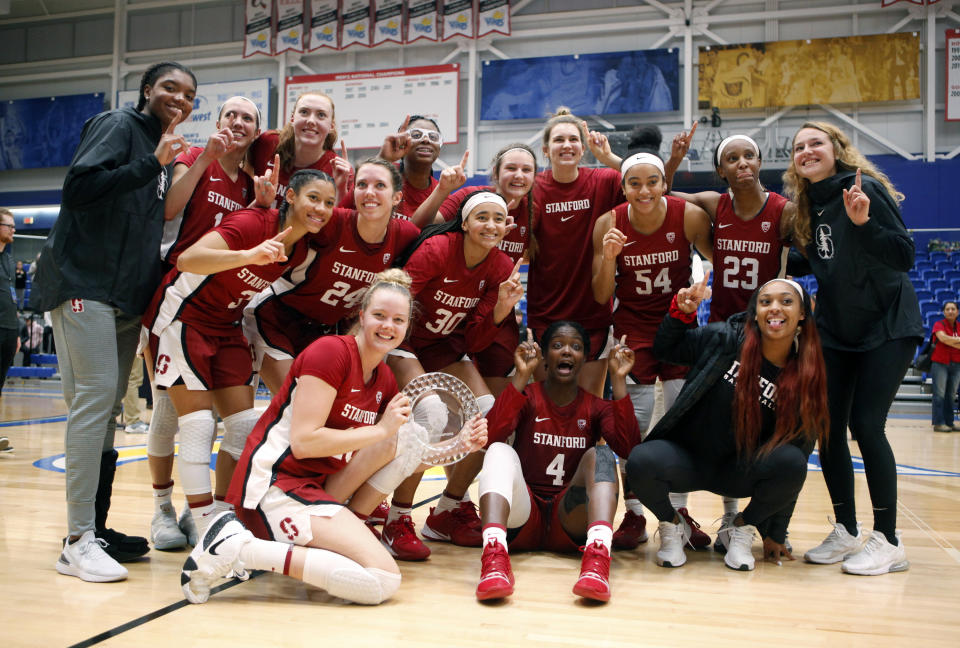 Stanford celebrates winning the championship over Mississippi State 67-62 at the Greater Victoria Invitational championship NCAA college basketball game in Victoria, British Columbia, Saturday, Nov. 30, 2019. (Chad Hipolito/The Canadian Press via AP)