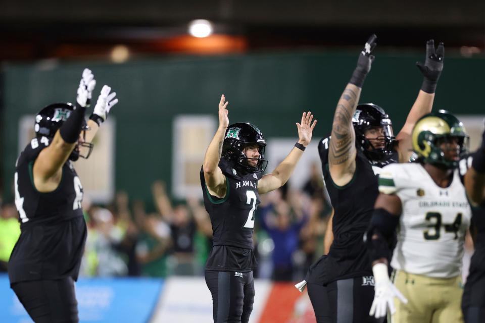 Hawaii place kicker Matthew Shipley (2), center, reacts with teammates after kicking a last second, 51-yard field goal against Colorado State during the second half of an NCAA college football game, Saturday, Nov. 25, 2023, in Honolulu. Hawaii defeated Colorado State 27-24. (AP Photo/Marco Garcia)