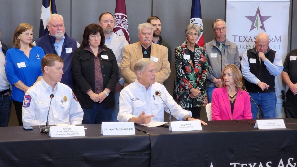 Texas Gov. Greg Abbott hosts a news conference with local and state emergency management officials Friday in Borger as fires rage across the Texas Panhandle.