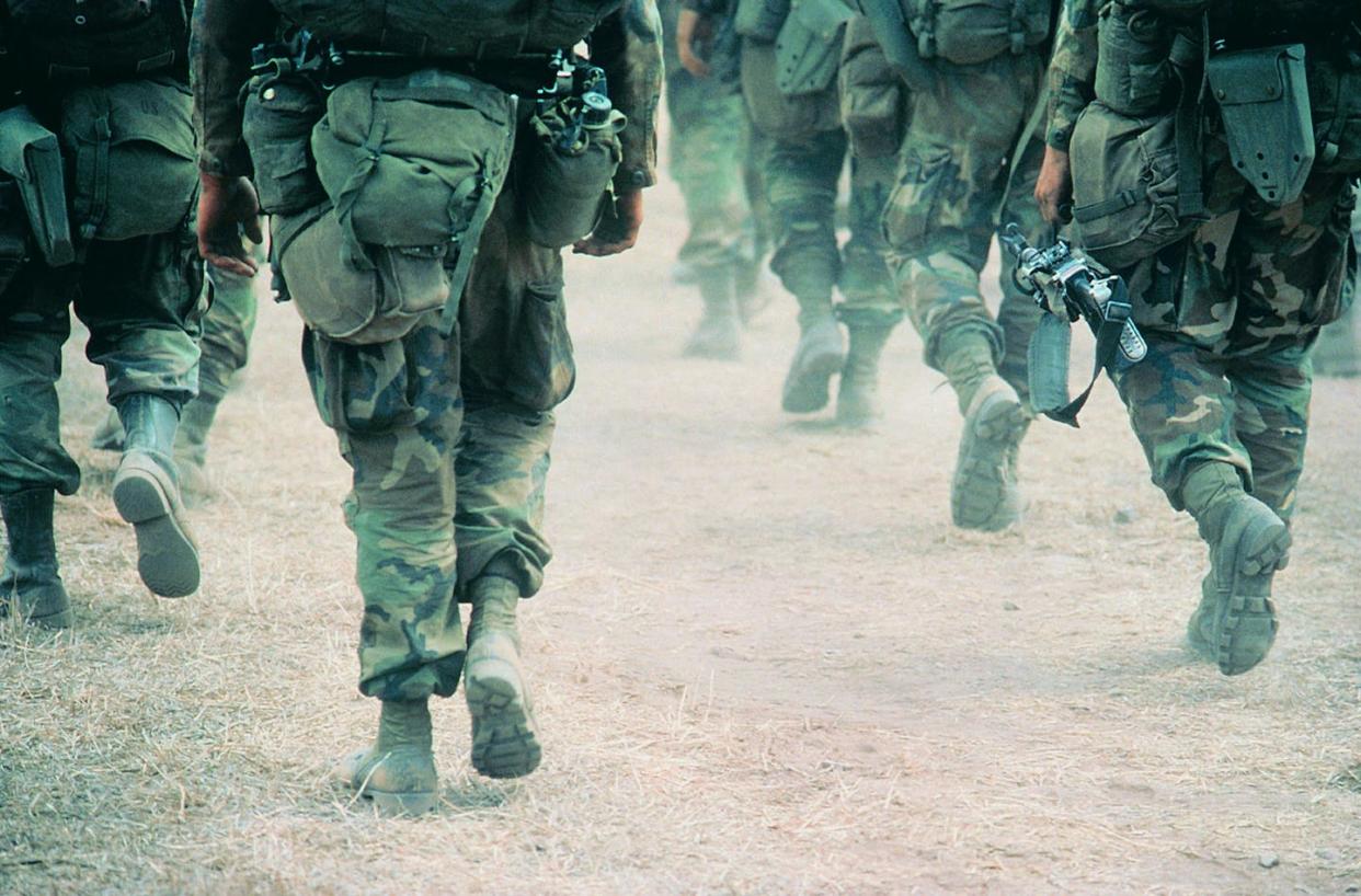 <span class="caption">White Americans who hold racist attitudes are likely to prefer military action over diplomacy in foreign countries like Iran and, in particular, China.</span> <span class="attribution"><a class="link " href="https://www.gettyimages.com/detail/photo/soldiers-marching-in-desert-royalty-free-image/dv144072?adppopup=true" rel="nofollow noopener" target="_blank" data-ylk="slk:Frank Rossoto Stocktrek via Getty;elm:context_link;itc:0;sec:content-canvas">Frank Rossoto Stocktrek via Getty</a></span>