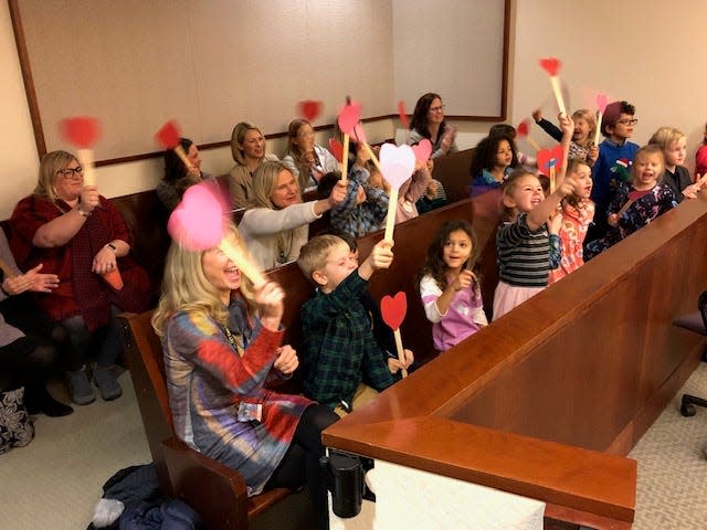 Students from Wealthy Elementary in East Grand Rapids, Michigan, celebrate the adoption of 5-year-old Michael Clark Jr.