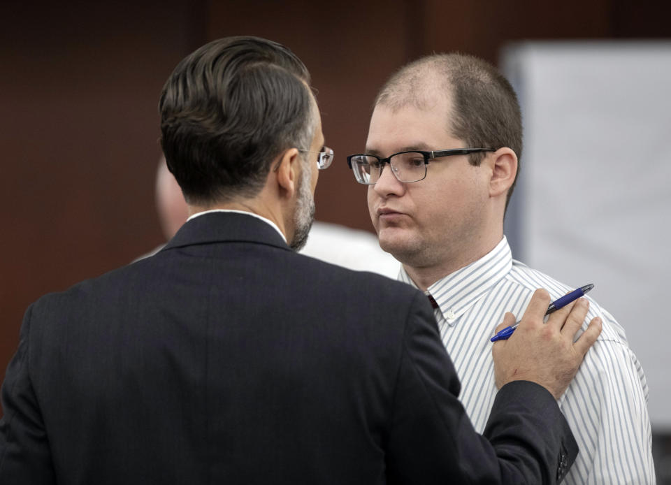 Defense attorney Casey Secor talks with Tim Jones during trial in Lexington, S.C. Timothy Jones, Jr., is accused of killing his five children in 2014. Jones, who faces the death penalty, has pleaded not guilty by reason of insanity. (Tracy Glantz/The State via AP, Pool)